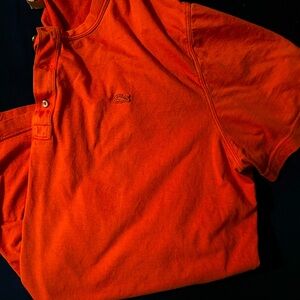 Men’s orange Lacoste, Henley tee shirt.